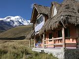 Ecuador Chimborazo 01-03 Estrella del Chimborazo Accommodation In The Afternoon With Chimborazo Behind The Estrella del Chimborazo has two separate buildings with four double rooms each. Here is the outside of our building with Chimborazo in the background.